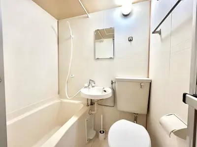 a small bathroom with a toilet and a sink at Shinjuku YC Hostel-SJ0399 in Tokyo