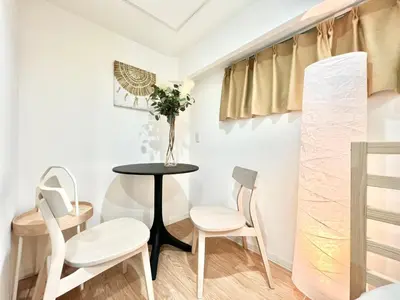 a small dining room with a table and chairs at Shinjuku YC Hostel-SJ0399 in Tokyo