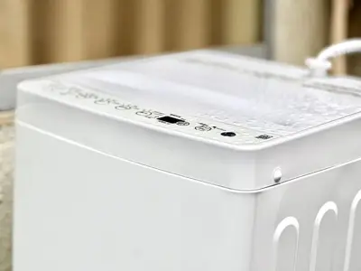 a white washing machine sitting next to a sink at Shinjuku YC Hostel-SJ0399 in Tokyo