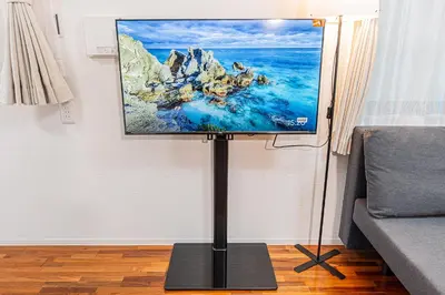 a flat screen tv on a stand in a living room at 67 Apt Nishishinjuku Premium in Tokyo