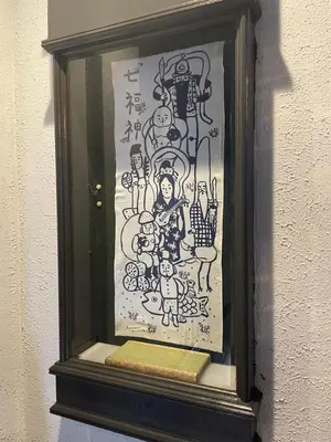 a picture in a frame on a wall at Tatami-Tokyo studio apartment in Tokyo