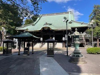 a pagoda with a fountain in front of a building at Tatami-Tokyo studio apartment in Tokyo