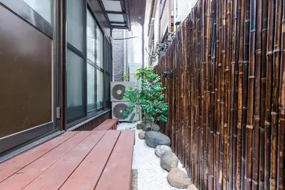 a hallway with a wooden floor and a building at Zen Home AKABANE in Tokyo