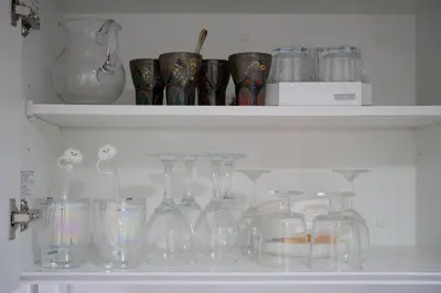 a shelf filled with glass jars and vases at Shibuya Center Street 4 minutes direct access to Shinjuku and Harajuku and Omotesando in Tokyo