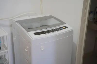 a microwave sitting on top of a refrigerator at Shibuya Center Street 4 minutes direct access to Shinjuku and Harajuku and Omotesando in Tokyo