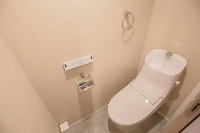 a bathroom with a white toilet in a stall at Central Yoyogi Guesthouse Y0YG in Tokyo