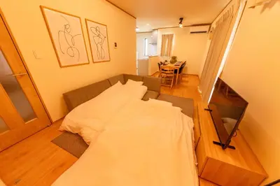 a bedroom with a bed in the middle of a room at HOTEL Zephyr Yotsugi - Vacation STAY 67085v in Tokyo
