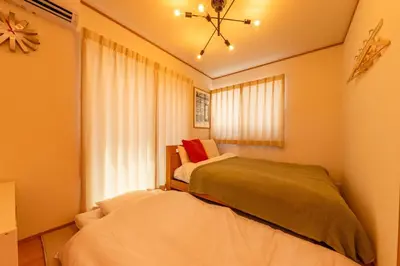 a small bedroom with a bed and a window at HOTEL Zephyr Yotsugi - Vacation STAY 67085v in Tokyo