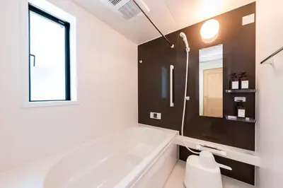 a white bathroom with a tub and a window at HOTEL Zephyr Yotsugi - Vacation STAY 67085v in Tokyo