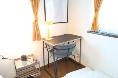 a desk in a room with a chair and a lamp at Toshima-ku - House - Vacation STAY 17508 in Tokyo