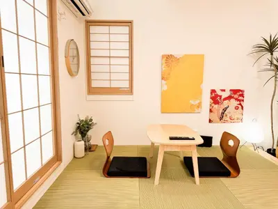 a dining room with a table and chairs at Triphome Shinjuku Takadanobaba Sakura House in Tokyo