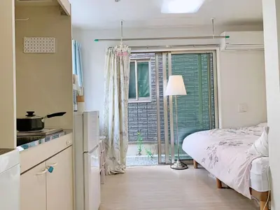 a small bedroom with a bed and a window at JR t akadababa subway 5 mins walk! Newly building \u65b0\u7bc9! \u9ad8\u7530\u99ac\u5834\u99c5 \u5f92\u6b69\u570f\u5185\u5927\u4eba\u6c17! Shinjuku\u65b0\u5bbf\u5708!\u9ad8\u901f\u65e0\u9650\u5236Wi-FI BC in Tokyo