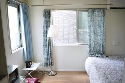 a bedroom with a bed and a window at JR t akadababa subway 5 mins walk! Newly building \u65b0\u7bc9! \u9ad8\u7530\u99ac\u5834\u99c5 \u5f92\u6b69\u570f\u5185\u5927\u4eba\u6c17! Shinjuku\u65b0\u5bbf\u5708!\u9ad8\u901f\u65e0\u9650\u5236Wi-FI BC in Tokyo