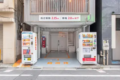 three vending machines are lined up outside of a building at \u30b0\u30e9\u30b9\u30ad\u30e3\u30d3\u30f3\u6d5c\u677e\u753ass Second and third floors in Tokyo