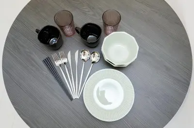 a table with a plate and utensils on it at Gran Duo Shirokane by Tranova in Tokyo