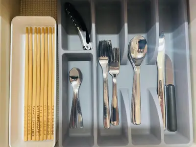a group of utensils in a plastic container at Beige2nd in Tokyo