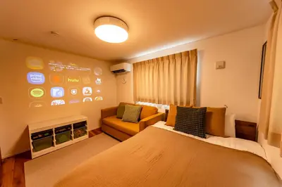 a hotel room with a bed and a couch at HOTEL Grand Star Tokyo in Tokyo