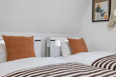 two beds sitting next to each other in a room at Modern Japan \u6771\u4eac\u6d45\u8349 east in Tokyo