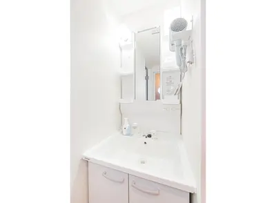 a white bathroom with a sink and a mirror at New Cozy APT Located on the Japanese Local shopping street in Tokyo