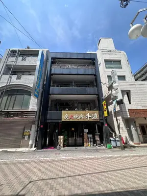 a building on the corner of a street at ikebukuro VX hefuyan7190 in Tokyo