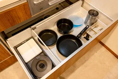 a kitchen with pots and pans on a stove at HOTEL Shibuya Tomigaya in Tokyo