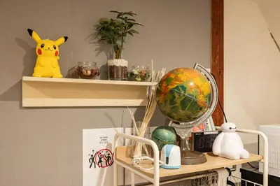 a shelf with a globe and other items on it at HOTEL Shibuya Tomigaya in Tokyo