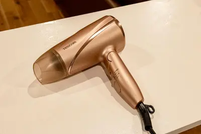 a iron sitting on top of a white table at HOTEL Shibuya Tomigaya in Tokyo