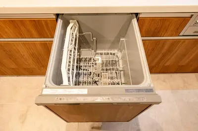 an open dishwasher with a dishwasher at HOTEL Shibuya Tomigaya in Tokyo
