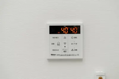 a white wall with a lightswitch on it at Momo-stay Ikebukuro in Tokyo