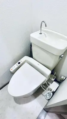 a bathroom with a white toilet and a sink at Shinjuku spacious apartment for max 8ppl in Tokyo