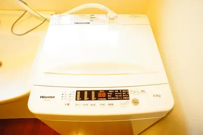 a close up of a washing machine on a wall at Holiday Akabane House - A Traditional Japanese House in Tokyo, with Direct Access to Shinjuku & Shibuya in Tokyo