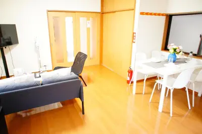 a living room with a couch and a table at Holiday Akabane House - A Traditional Japanese House in Tokyo, with Direct Access to Shinjuku & Shibuya in Tokyo