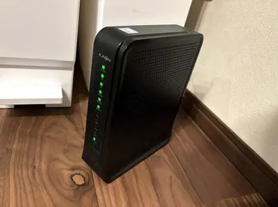 a black speaker sitting on the floor next to a refrigerator at \u6771\u6d45\u83492\u4e01\u76eeb101 in Tokyo