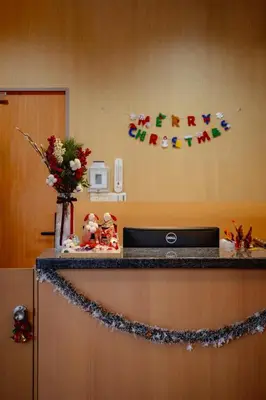 a counter with a happy christmas sign on a wall at E JOY INN-Higashi Nipoori in Tokyo