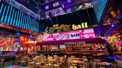 a restaurant with chairs and a bar with neon lights at \u65b0\u5bbf\u5e02\u4e2d\u5fc3\u6b4c\u821e\u4f0e\u753a\u6771\u65b0\u5bbf\u99c5\u5f92\u6b653\u5206\u9418\u514d\u8cbbWi-Fi in Tokyo