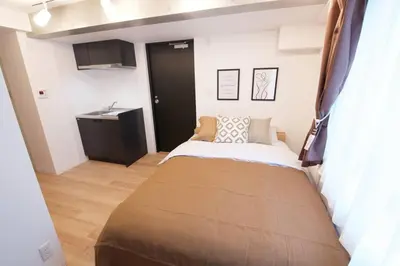 a bedroom with a bed in a room at The Geminis Ikebukuro301 in Tokyo