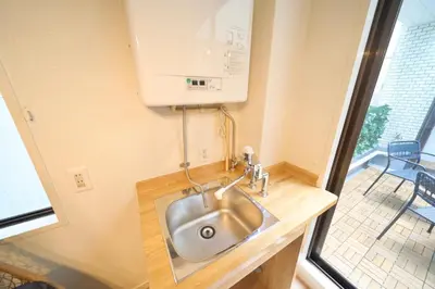 a kitchen with a stainless steel sink and a window at Nakagawa Building - Vacation STAY 17546 in Tokyo
