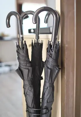 a group of black umbrellas hanging on a door at Zen Abode404 Japanese-style and modern Western-style rooms in Tokyo