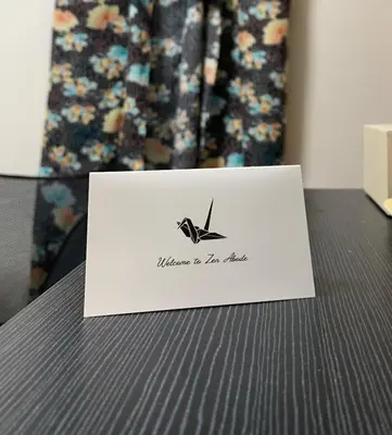 a piece of paper sitting on top of a table at Zen Abode404 Japanese-style and modern Western-style rooms in Tokyo