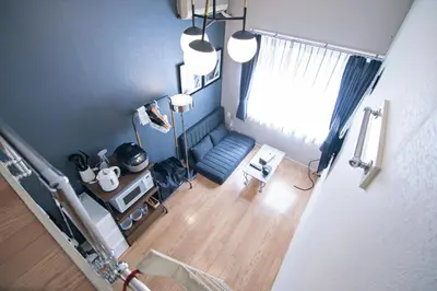 an overhead view of a living room with blue walls at Plaza de La Brea in Tokyo