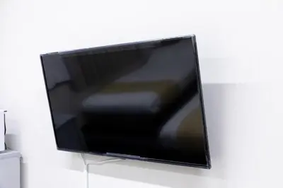 a flat screen tv hanging on a wall at \u6d45\u8349\u30a2\u30d1\u30fc\u30c8\u30e1\u30f3\u30c8 in Tokyo