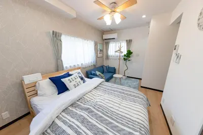 a bedroom with a bed and a ceiling fan at Tate Stay,TOKYO - Vacation STAY 96712 in Tokyo