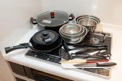 a pile of kitchen utensils sitting on top of a counter at Tate Stay,TOKYO - Vacation STAY 96712 in Tokyo