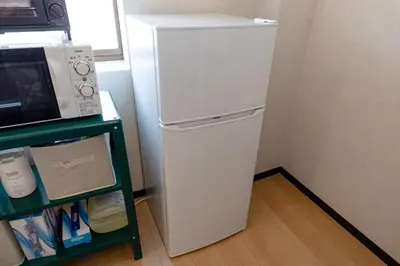 a white refrigerator in a kitchen next to a microwave at Tate Stay,TOKYO - Vacation STAY 96712 in Tokyo