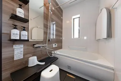 a bathroom with a tub and a toilet and a sink at Tate Stay,TOKYO - Vacation STAY 96712 in Tokyo