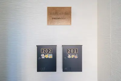 two black clocks on the side of a white wall at Itabashi Minamicho ten, Diamond Yu - Vacation STAY 61425v in Tokyo