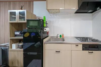 a small kitchen with a sink and a microwave at Itabashi Minamicho ten, Diamond Yu - Vacation STAY 61425v in Tokyo