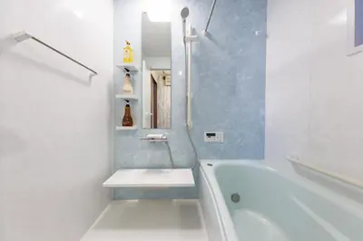 a white bathroom with a tub and a sink at Bliss KAMEARI in Tokyo
