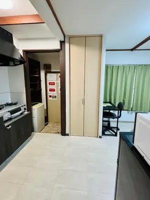 an empty room with a kitchen and a table at RED House｜12 minutes from the station｜Quiet area｜Direct access to Shinjuku & Akihabara in Tokyo