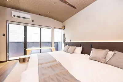 a bedroom with a large bed and a large window at Asakura Ninja House Tokyostoryhotel, Tokyo Skytree in Tokyo